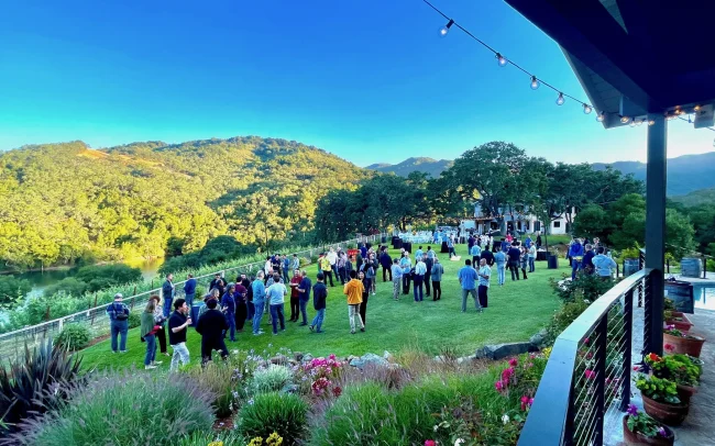 Outdoor wine event on the grassy lawn at Alamitos Vineyards with views of the hillsides